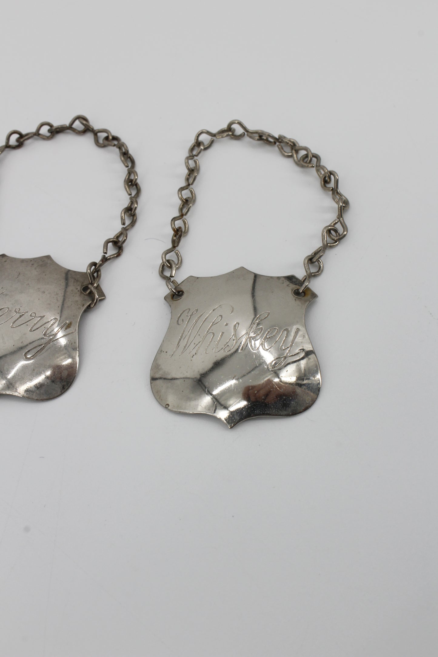 Trio of Sterling Silver Bottle Tags & Antique Book