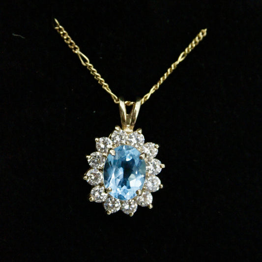 Blue Topaz Halo Pendant, 3.63 Carats 10K Gold