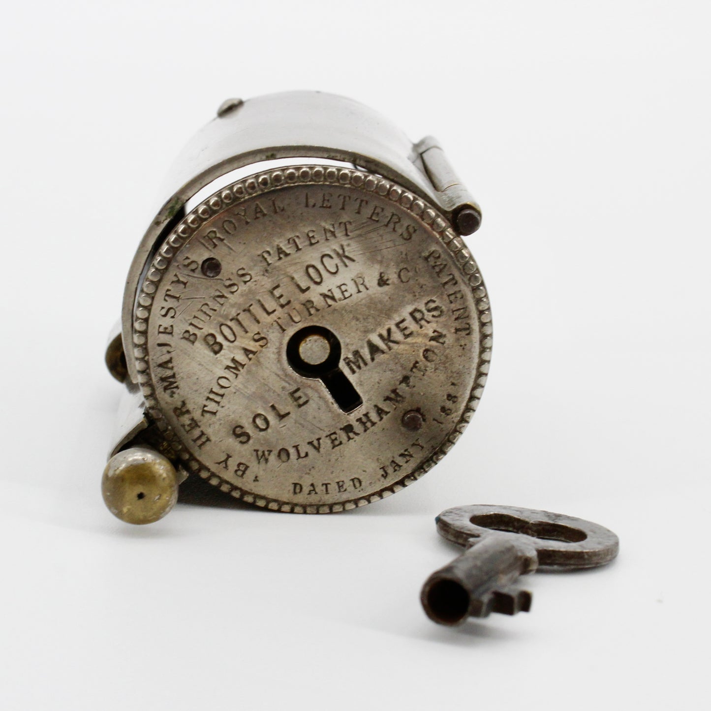1881 Burns's Royal Patent Bottle Lock & Key Set by Thomas Turner & Co.