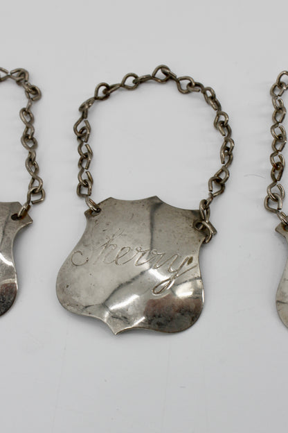 Trio of Sterling Silver Bottle Tags & Antique Book