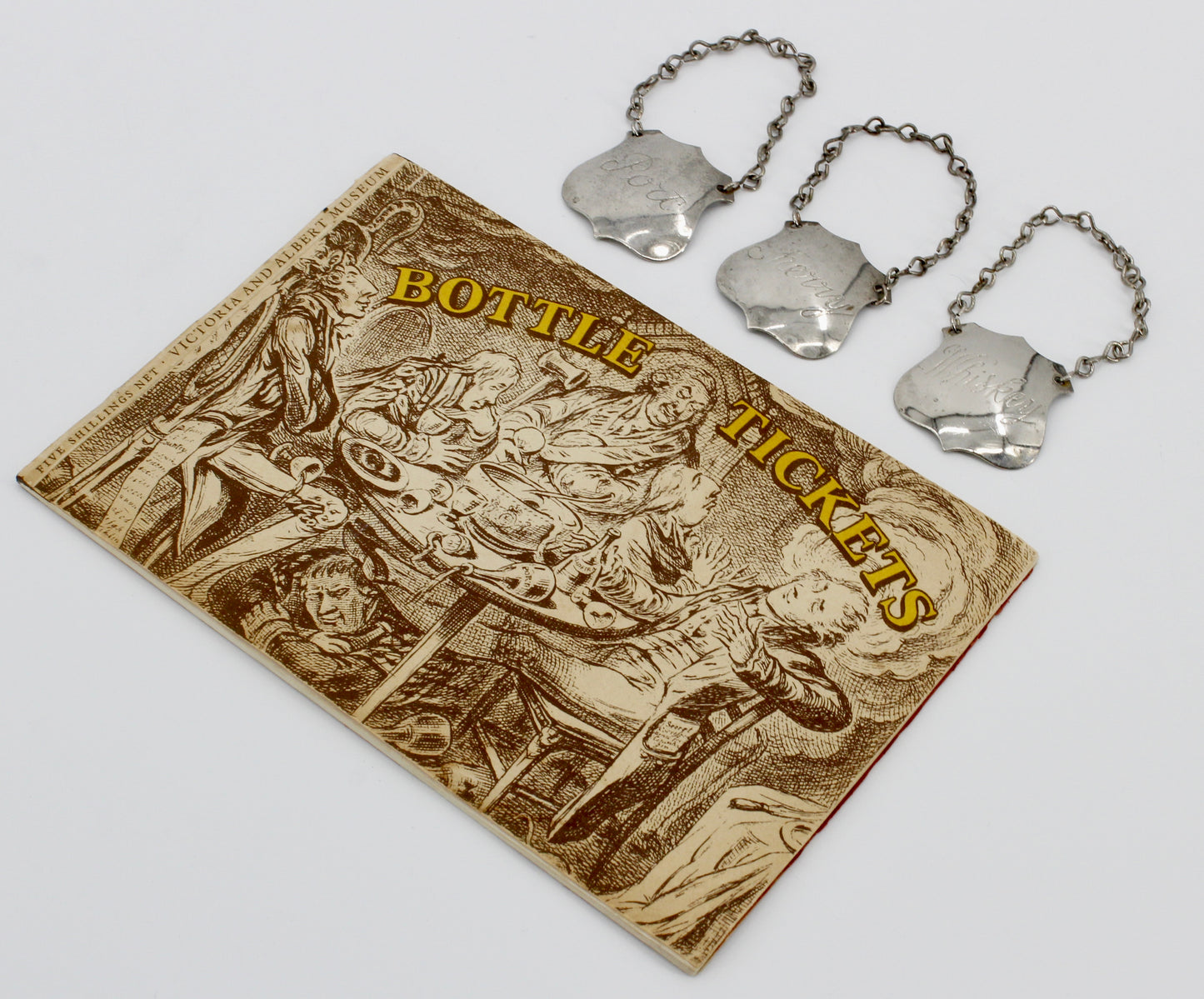 Trio of Sterling Silver Bottle Tags & Antique Book