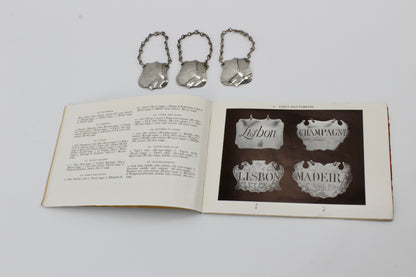 Trio of Sterling Silver Bottle Tags & Antique Book