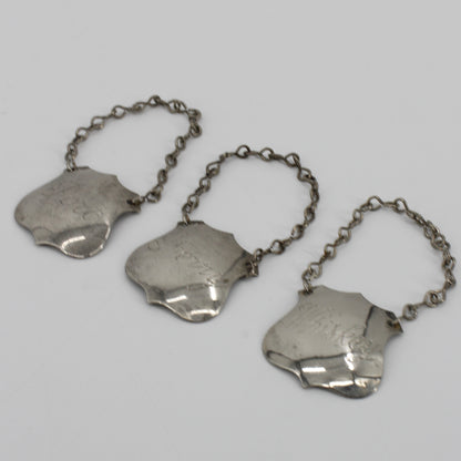 Trio of Sterling Silver Bottle Tags & Antique Book